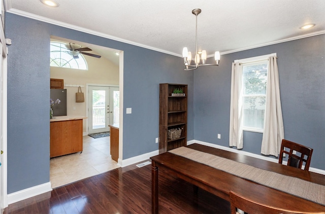 1807 11th St, Des Moines, IA 50314 - dining space with crown molding, a chandelier, healthy amount of natural light, light wood-type flooring, and a ceiling fan