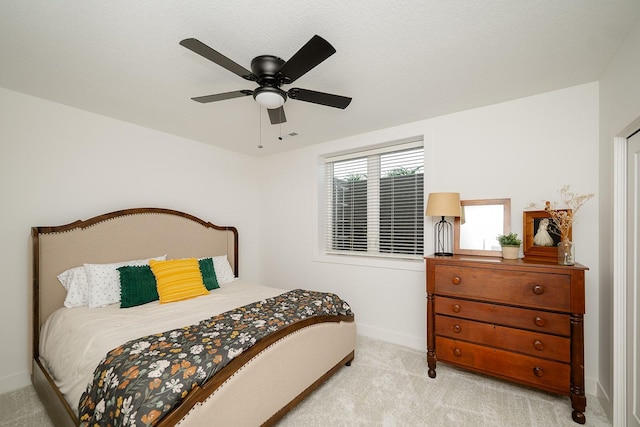 16427 N Valley Dr, Urbandale, IA 50323 - carpeted bedroom featuring baseboards and ceiling fan