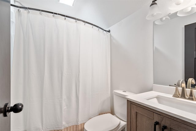 208 Mckinley Ave, Des Moines, IA 50315 - bathroom featuring toilet, vanity, and a shower with curtain