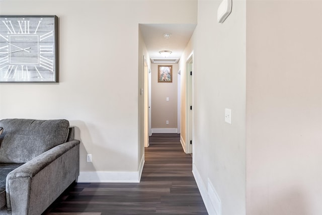 208 Mckinley Ave, Des Moines, IA 50315 - corridor featuring dark wood finished floors and baseboards