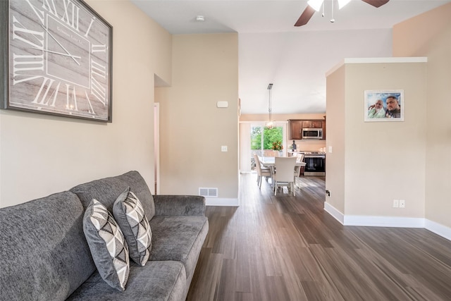 208 Mckinley Ave, Des Moines, IA 50315 - living area featuring a ceiling fan, dark wood-style flooring, and baseboards