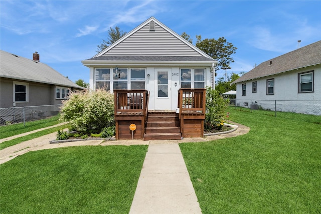 2402 Elizabeth Ave, Des Moines, IA 50317 - view of front of house featuring a wooden deck and a shingled roof