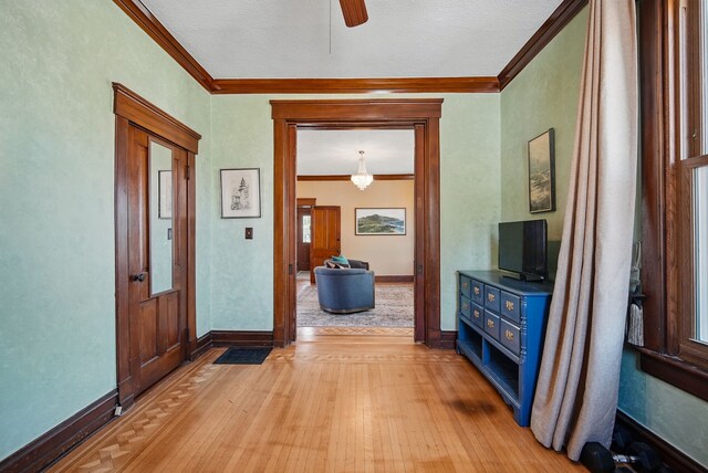 311 E Main St, Panora, IA 50216 - hallway featuring light wood-style flooring, crown molding, and baseboards