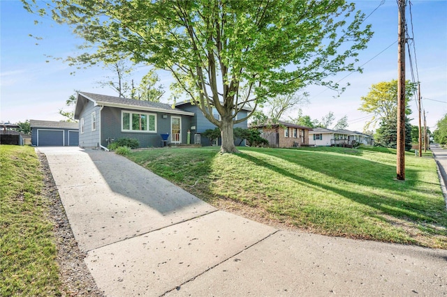 2106 62nd St, Des Moines, IA 50322 - view of front of property with a front yard, a garage, and concrete driveway
