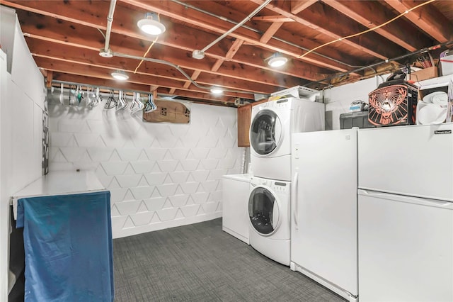 2106 62nd St, Des Moines, IA 50322 - laundry room with stacked washer / drying machine and dark carpet