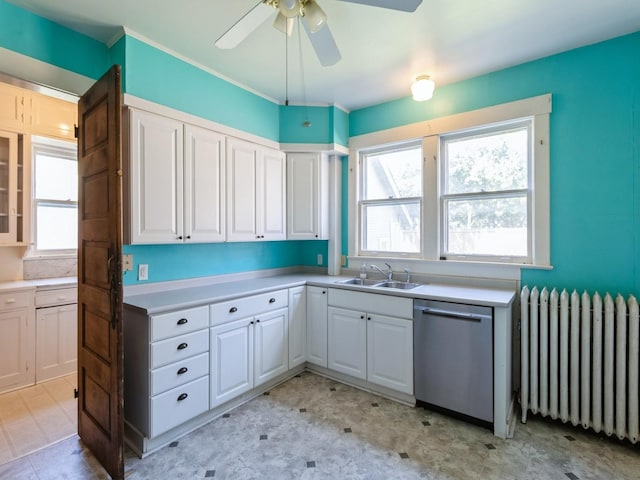 1070 37th St, Des Moines, IA 50311 - kitchen featuring radiator heating unit, stainless steel dishwasher, a sink, ceiling fan, and light flooring