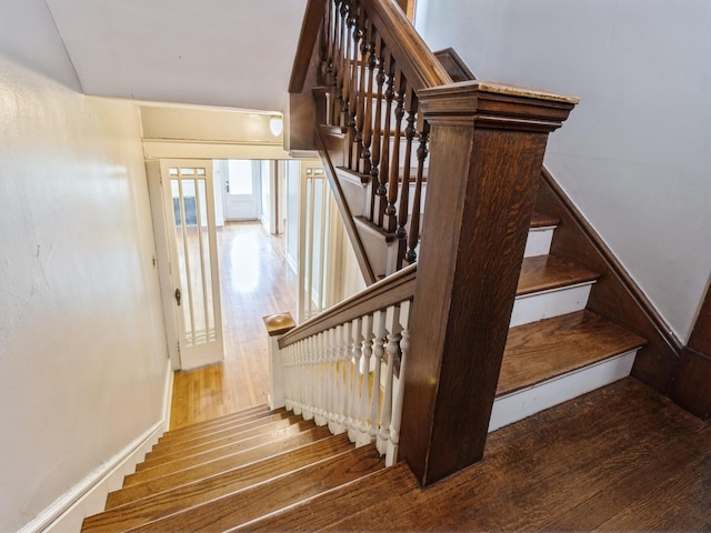 1070 37th St, Des Moines, IA 50311 - stairway featuring hardwood / wood-style flooring