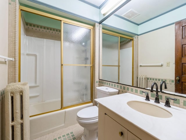 1070 37th St, Des Moines, IA 50311 - full bathroom featuring radiator heating unit, tile patterned floors, toilet, shower / tub combination, and vanity