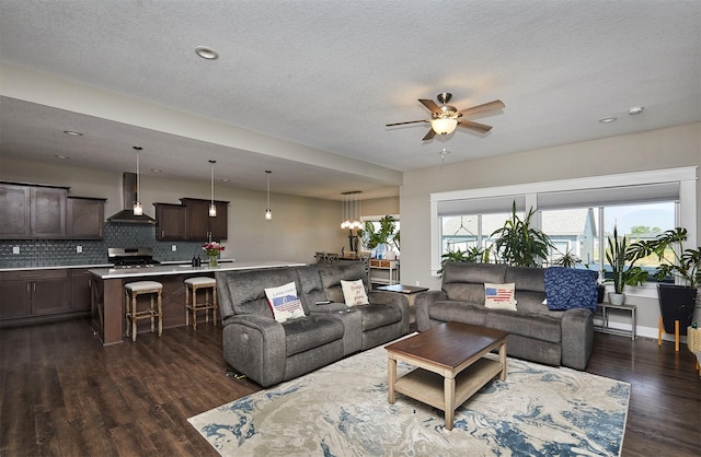 1412 NE Aspen Ct, Grimes, IA 50111 - living area featuring dark wood-style floors, a ceiling fan, a textured ceiling, and recessed lighting