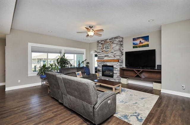 1412 NE Aspen Ct, Grimes, IA 50111 - living area with baseboards, ceiling fan, a stone fireplace, wood finished floors, and recessed lighting