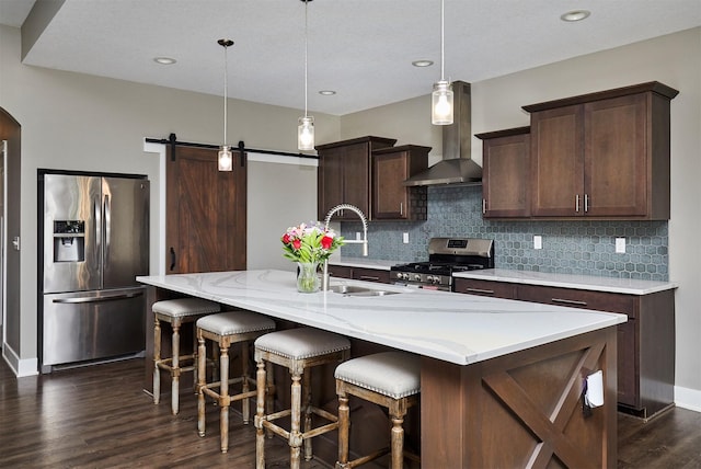 1412 NE Aspen Ct, Grimes, IA 50111 - kitchen with appliances with stainless steel finishes, dark wood finished floors, wall chimney exhaust hood, a sink, and backsplash