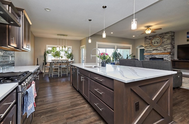 1412 NE Aspen Ct, Grimes, IA 50111 - kitchen with a sink, stainless steel appliances, a ceiling fan, dark wood-style flooring, and dark brown cabinetry