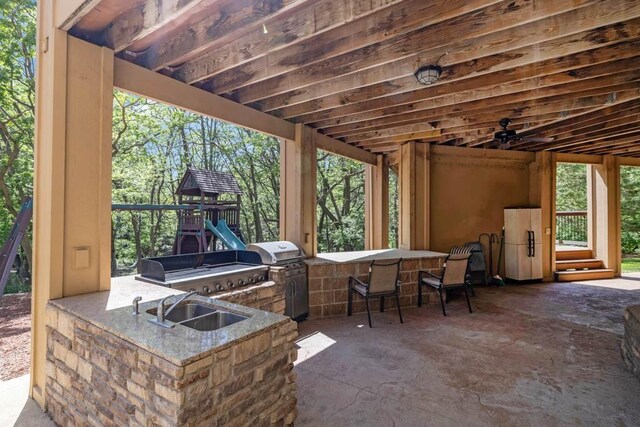 4408 Cochrane Pkwy, Ames, IA 50014 - view of patio featuring an outdoor kitchen, a playground, exterior bar, and area for grilling