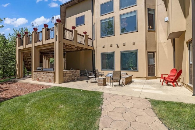 4408 Cochrane Pkwy, Ames, IA 50014 - back of house with a patio, stairway, and stucco siding