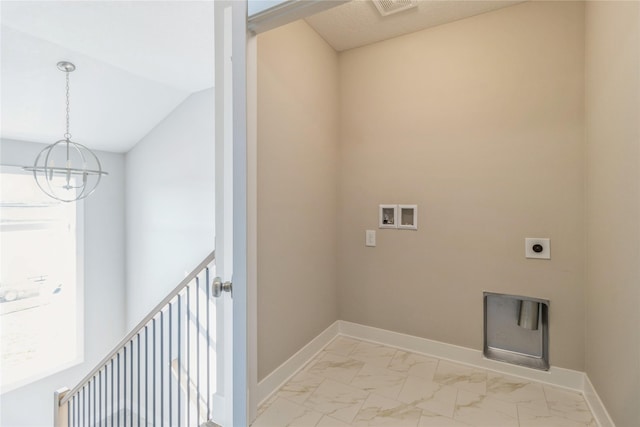 17151 Plum Dr, Urbandale, IA 50323 - laundry area with hookup for a washing machine, a chandelier, light marble finish floors, and baseboards