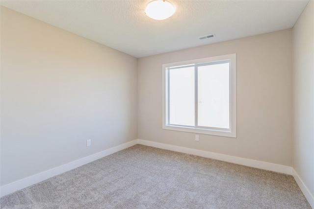 17151 Plum Dr, Urbandale, IA 50323 - empty room featuring carpet floors and baseboards