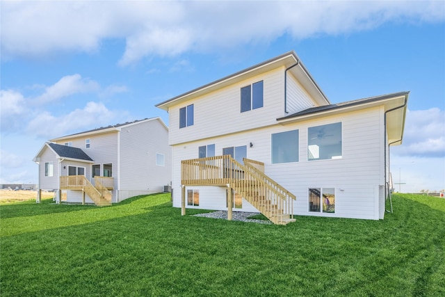 17151 Plum Dr, Urbandale, IA 50323 - rear view of property with stairs, a lawn, and a wooden deck