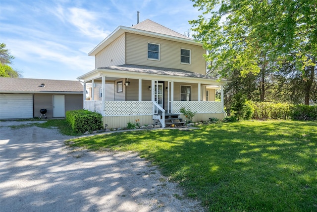 630 E Clay St, Osceola, IA 50213 - traditional style home featuring a front lawn, a porch, gravel driveway, and roof with shingles