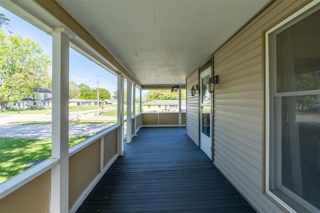 630 E Clay St, Osceola, IA 50213 - wooden terrace featuring covered porch