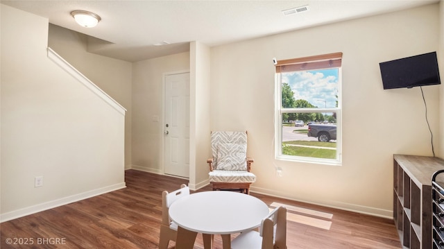 1508 E Euclid Ave, Indianola, IA 50125 - living area with wood finished floors, baseboards, and stairs