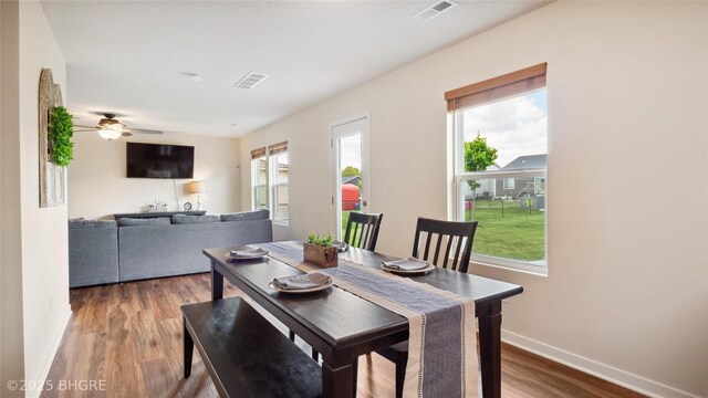 1508 E Euclid Ave, Indianola, IA 50125 - dining space with baseboards, wood finished floors, and a ceiling fan