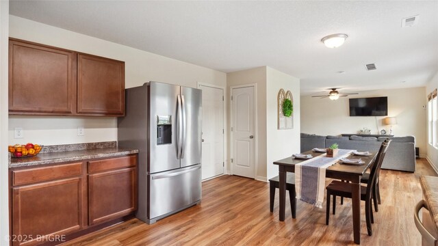 1508 E Euclid Ave, Indianola, IA 50125 - kitchen featuring stainless steel fridge, light wood finished floors, a ceiling fan, and open floor plan