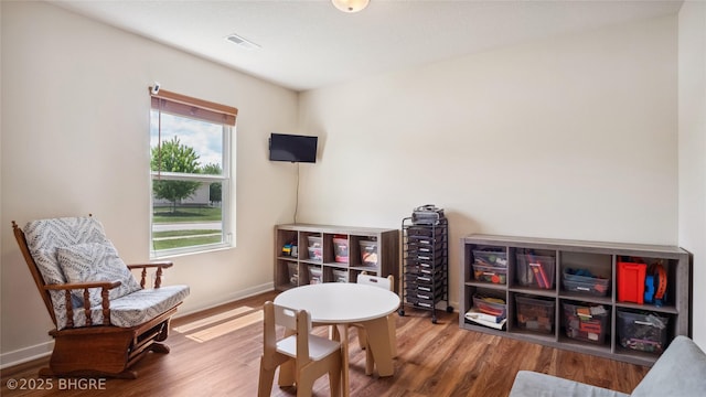 1508 E Euclid Ave, Indianola, IA 50125 - living area featuring wood finished floors and baseboards