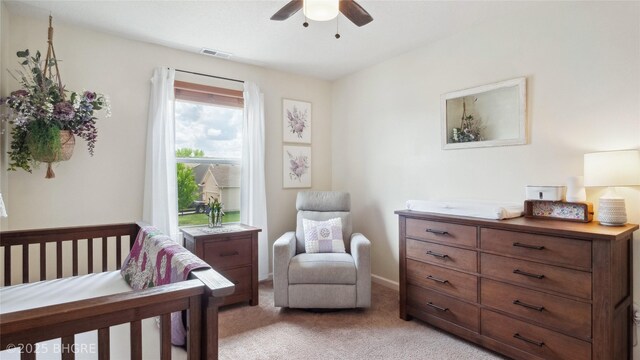 1508 E Euclid Ave, Indianola, IA 50125 - bedroom with light colored carpet and ceiling fan