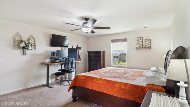 1508 E Euclid Ave, Indianola, IA 50125 - carpeted bedroom featuring baseboards, an office area, and ceiling fan