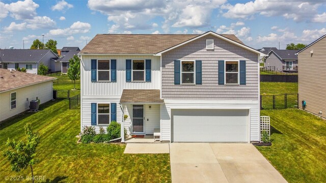 1508 E Euclid Ave, Indianola, IA 50125 - view of front of property with an attached garage, driveway, a residential view, and central AC unit