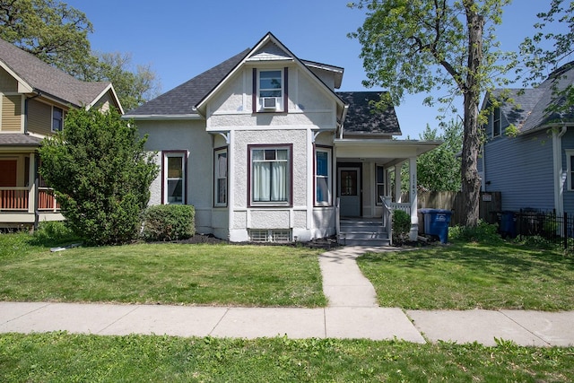 1143 27th St, Des Moines, IA 50311 - view of front of home featuring covered porch, stucco siding, and roof with shingles