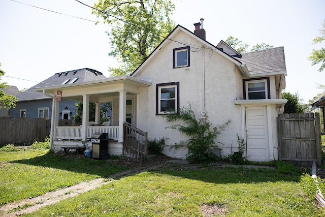 1143 27th St, Des Moines, IA 50311 - rear view of property with a porch, stucco siding, a chimney, and a shingled roof