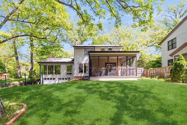 3312 Oakland St, Ames, IA 50014 - rear view of property featuring a sunroom and a chimney