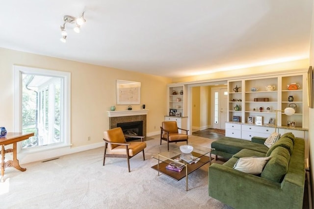 3312 Oakland St, Ames, IA 50014 - living room with a fireplace with flush hearth, baseboards, and light carpet