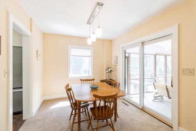 3312 Oakland St, Ames, IA 50014 - dining space featuring healthy amount of natural light, carpet, and baseboards