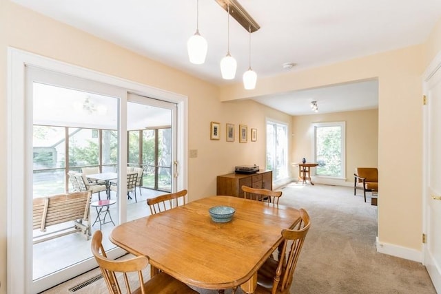 3312 Oakland St, Ames, IA 50014 - dining area featuring light colored carpet and baseboards
