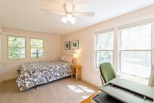 3312 Oakland St, Ames, IA 50014 - carpeted bedroom with baseboards, a ceiling fan, and an office area