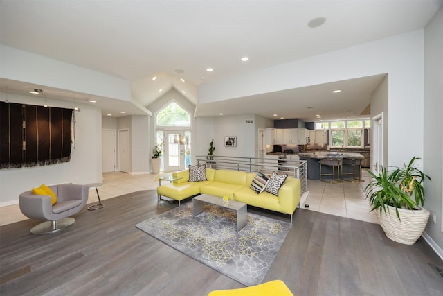 14943 Holcomb Ave, Clive, IA 50325 - living area with healthy amount of natural light, light wood finished floors, recessed lighting, and lofted ceiling