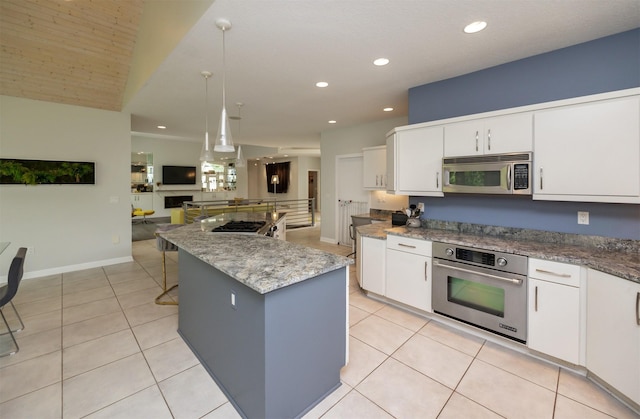 14943 Holcomb Ave, Clive, IA 50325 - kitchen featuring stainless steel appliances, open floor plan, white cabinets, light tile patterned floors, and recessed lighting