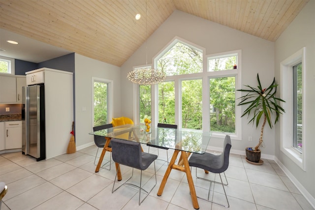 14943 Holcomb Ave, Clive, IA 50325 - dining space with light tile patterned flooring, a chandelier, high vaulted ceiling, and recessed lighting