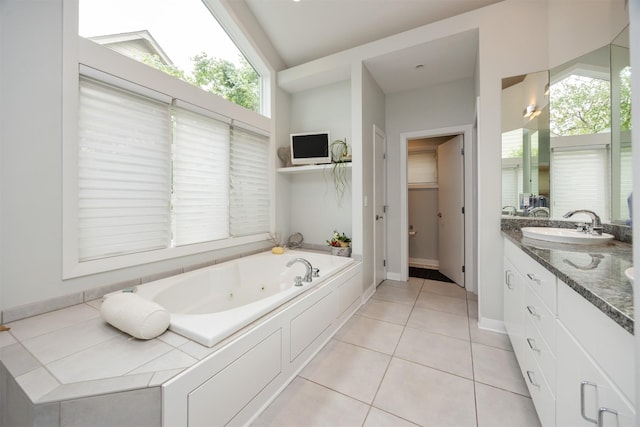 14943 Holcomb Ave, Clive, IA 50325 - bathroom featuring a whirlpool tub, vanity, and tile patterned flooring
