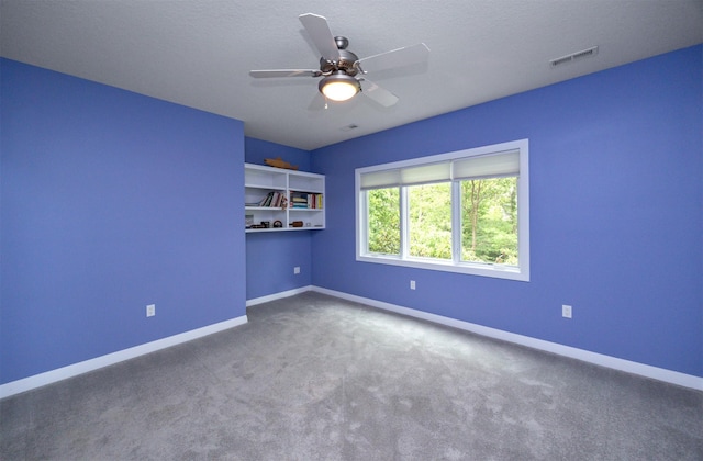 14943 Holcomb Ave, Clive, IA 50325 - carpeted spare room featuring baseboards and a ceiling fan