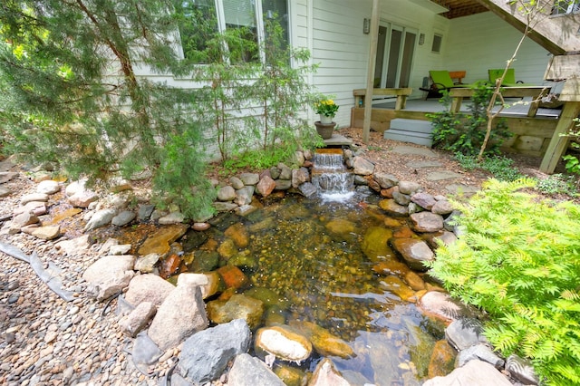 14943 Holcomb Ave, Clive, IA 50325 - view of yard featuring a garden pond