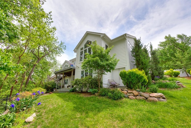14943 Holcomb Ave, Clive, IA 50325 - rear view of house with a yard and a deck