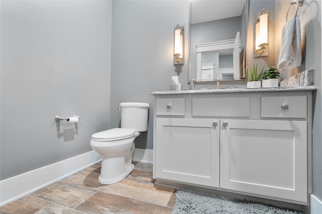 6296 Sudbury Ct, Johnston, IA 50131 - bathroom featuring toilet, vanity, and baseboards