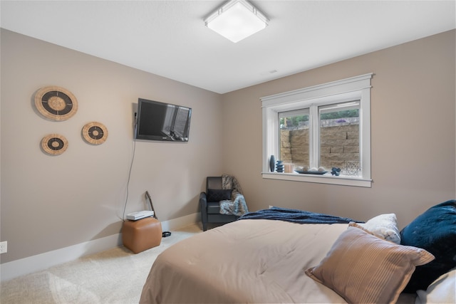 carpeted bedroom with baseboards
