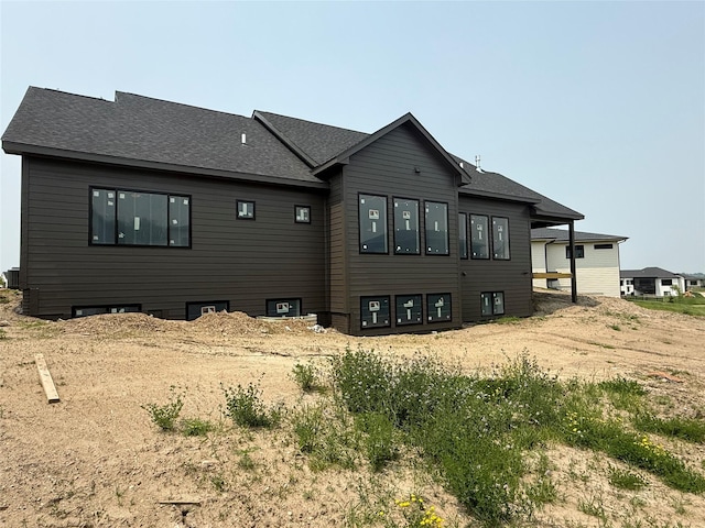 1128 NW 29th Ct, Grimes, IA 50111 - rear view of property featuring a shingled roof
