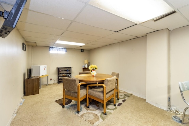 2322 E 39th St, Des Moines, IA 50317 - carpeted dining area with a paneled ceiling and baseboards