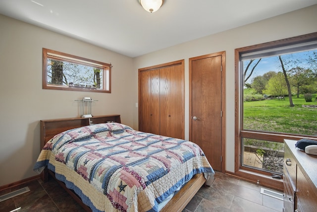6252 Panorama Dr, Panora, IA 50216 - bedroom featuring two closets and baseboards