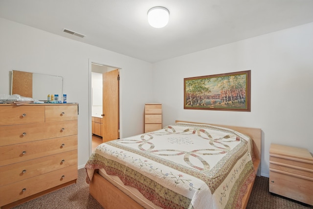 6252 Panorama Dr, Panora, IA 50216 - bedroom featuring dark colored carpet, ensuite bathroom, and baseboards